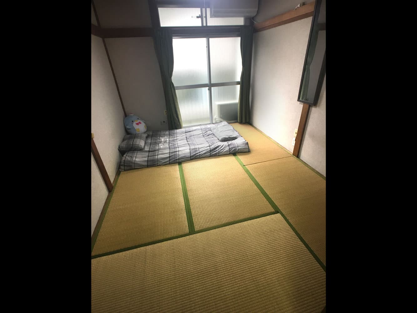 The traditional Japanese bedroom at Mitaka House, with a futon to sleep on tatami mats.